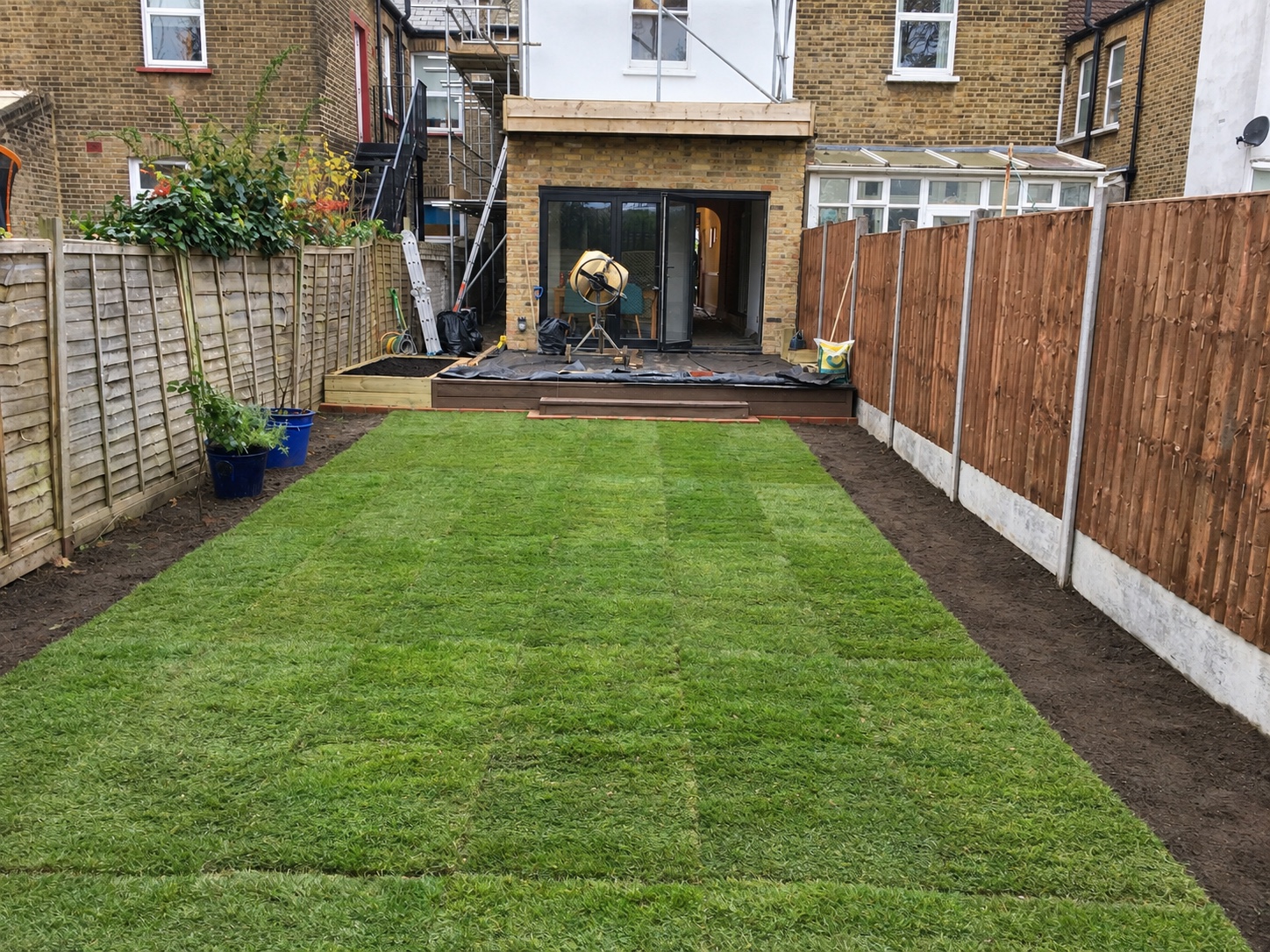 Fresh turf laid in a rear garden during a Fab Garden project